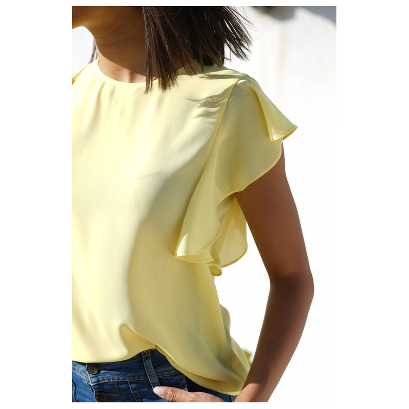 Blouse élégante de couleur poire claire.