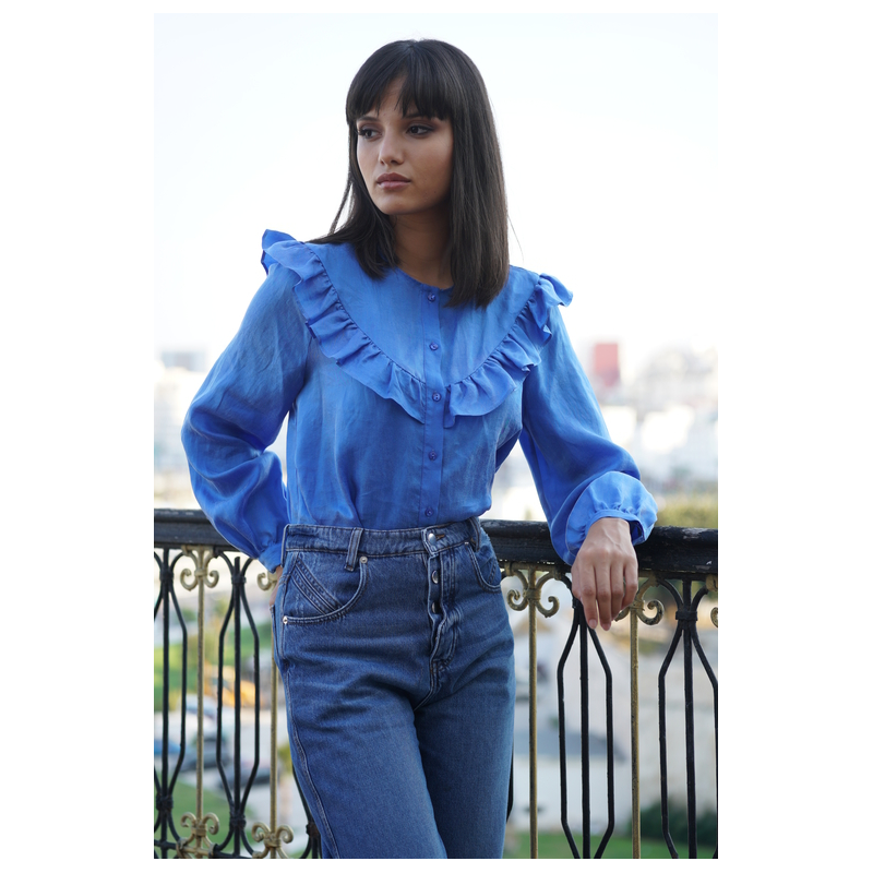 Blouse volantée à col rond d'une couleur bleue