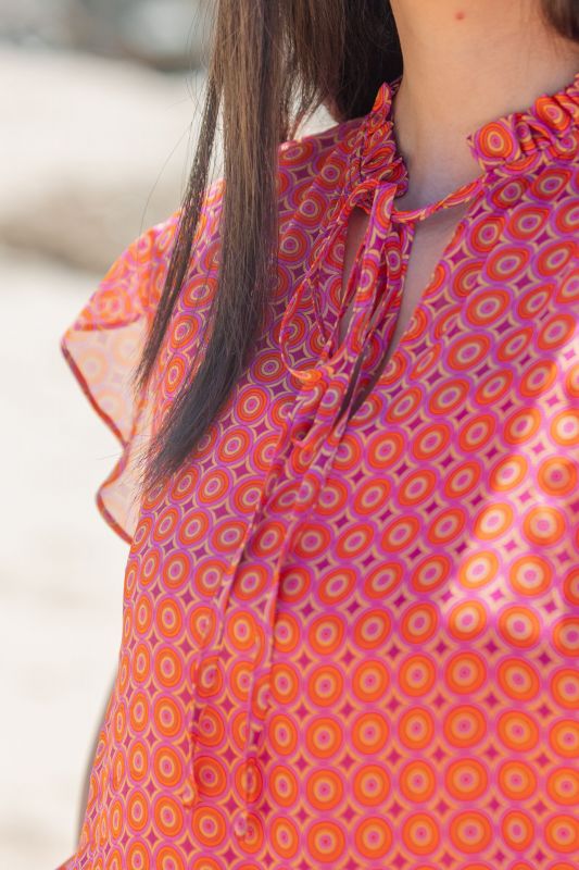 Blouse de couleur corail stylée