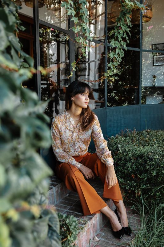 Blouse imprimée d'anaè, affichant des motifs colorés et un style élégant.