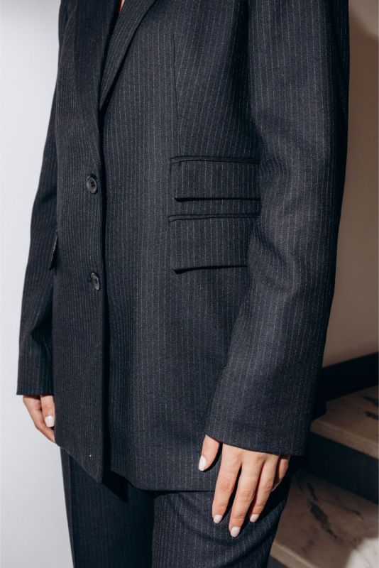 Élégance contemporaine avec la veste blazer Jeff d'ANAE, coupe structurée en tweed pinstripe.