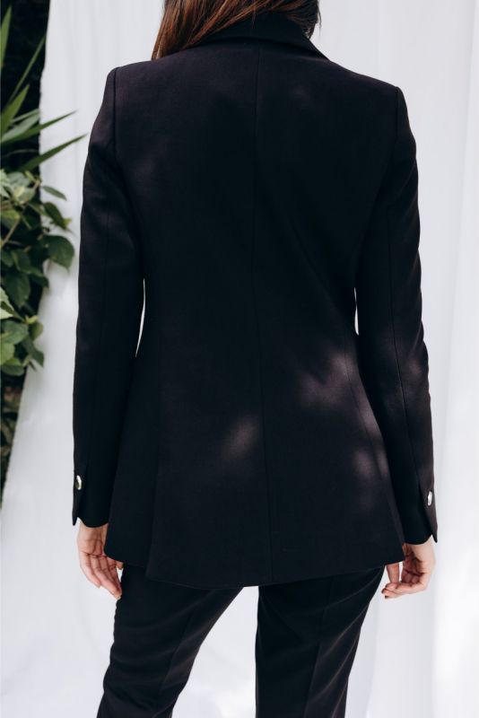 Dos de la veste 'Lorena' ANAE, coupe cintrée qui accentue la silhouette, sophistication en toute simplicité.